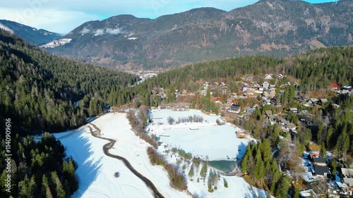 Jezero Jasna, a stunning alpine lake near Kranjska Gora, Slovenia, is a magical sight in winter when its surface freezes and the surrounding peaks are covered in snow photo