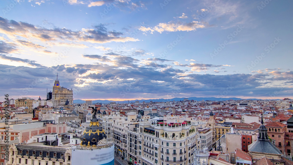 Fototapeta premium Panoramic aerial view of Gran Via timelapse before sunset, Skyline Old Town Cityscape, Metropolis Building, capital of Spain