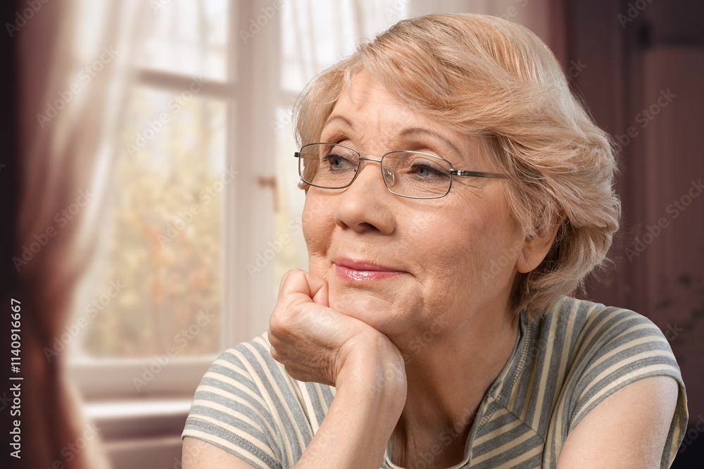 Nostalgia concept, old woman thinking at home Nostalgia concept, old woman thinking at home
