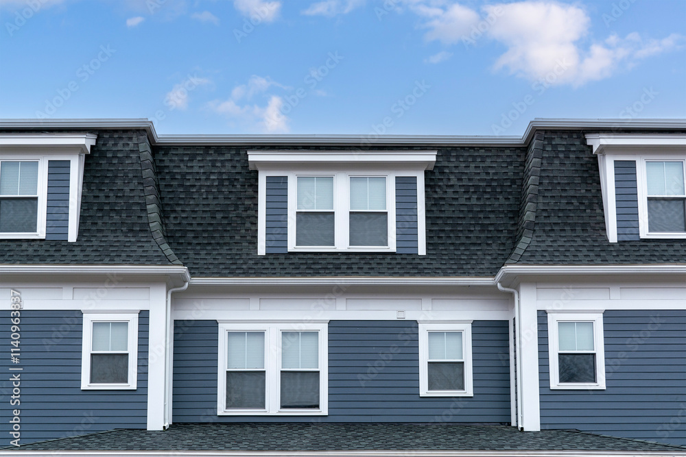 Classic mansard roof with dormer windows on residential building in Brighton, Massachusetts, USA
Classic mansard roof with dormer windows on residential building in Brighton, Massachusetts, USA