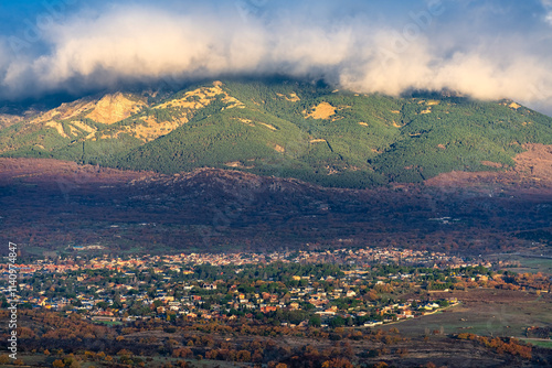 Thick clouds coming down from the mountain towards the village of Soto del Real, Madrid, Spain.