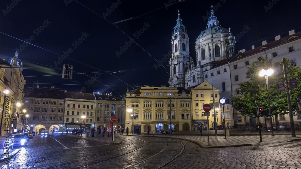 Fototapeta premium Night view of the illuminated malostranske namesti square timelapse hyperlapse in prague