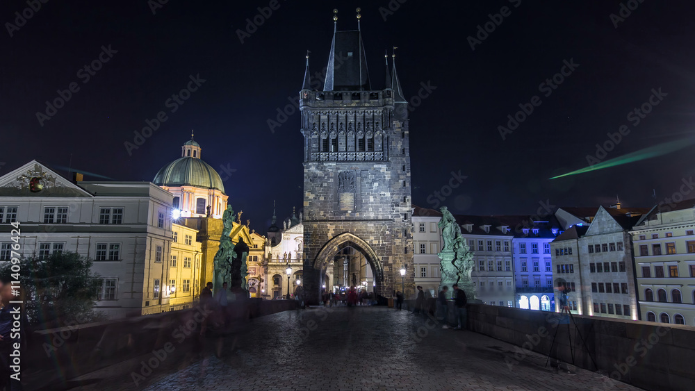 Fototapeta premium Magnificent Gothic structure called Stare Mesto Tower timelapse hyperlapse on Charles Bridge
