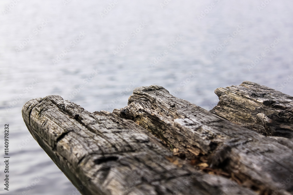 old wooden bench with a lake in the background old wooden bench with a lake in the background