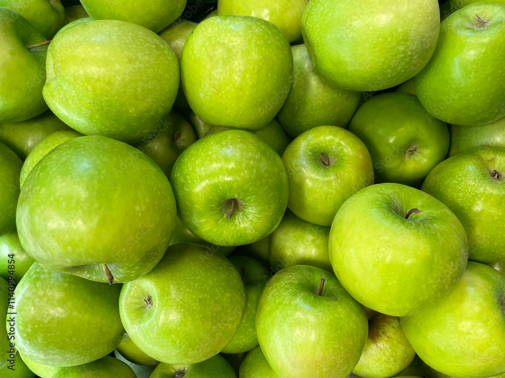 Heap of green apples as background, texture. Healthy eating. Full frame of green apples. Fresh apples from the market. Group of picked raw apples, top view. Heap of green apples as background, texture. Healthy eating. Full frame of green apples. Fresh apples from the market. Group of picked raw apples, top view.