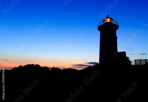 The Nobska Point Lighthouse Tower  In silhouette, Woods Hole, Cape Cod, Massachusetts..tif photo