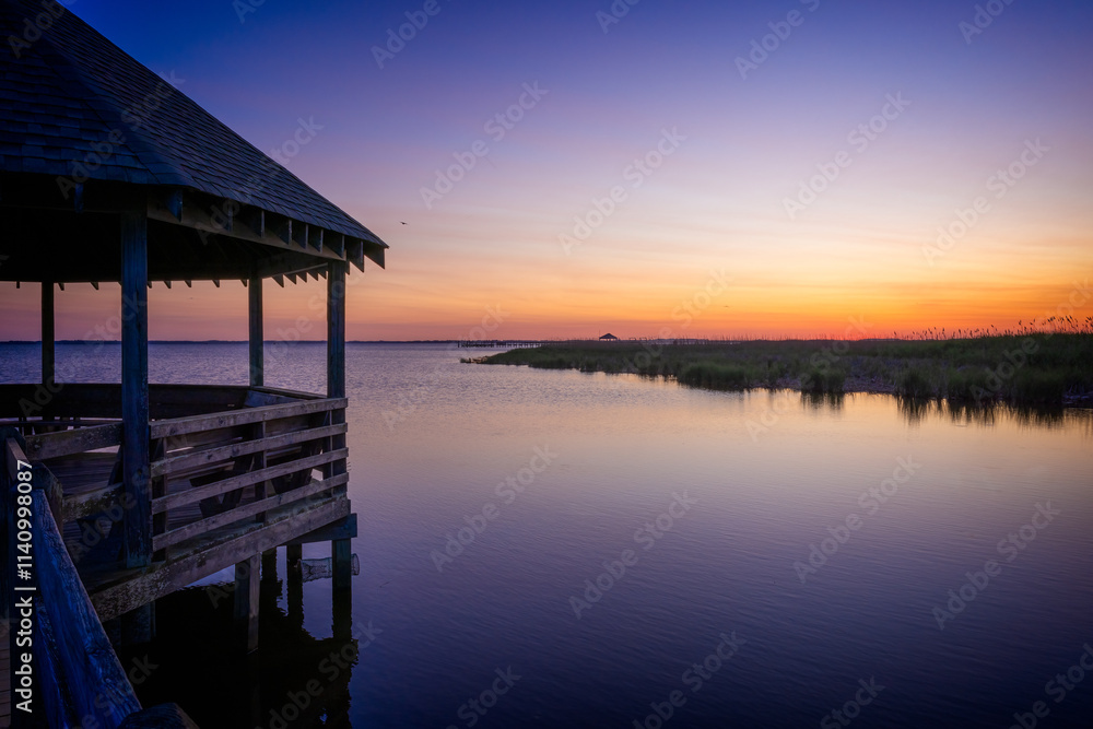 Wooden Gazebo line the coastline of Corolla in Outerbanks at sunset Wooden Gazebo line the coastline of Corolla in Outerbanks at sunset