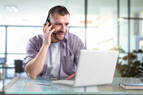 Busy support service worker talking to customer