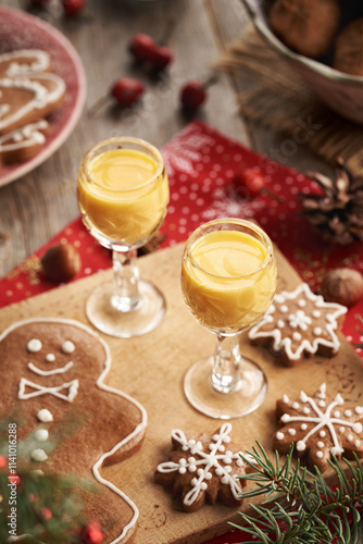 Two glasses of Eiecognac with gingerbread Christmas cookies photo