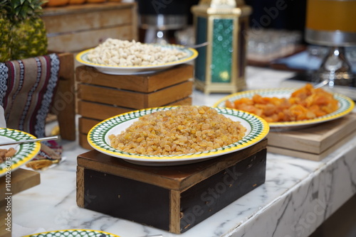 A delightful display of traditional Middle Eastern sweets elegantly presented on decorative plates, highlighting the rich textures and flavors of this exquisite culinary heritage