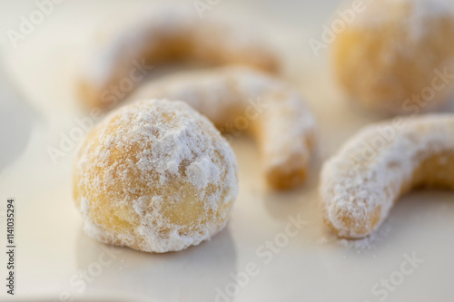 Vanillekipferl typical czech sweet Christmas baking cookies, vanilla rolls crescent moon with white icing photo