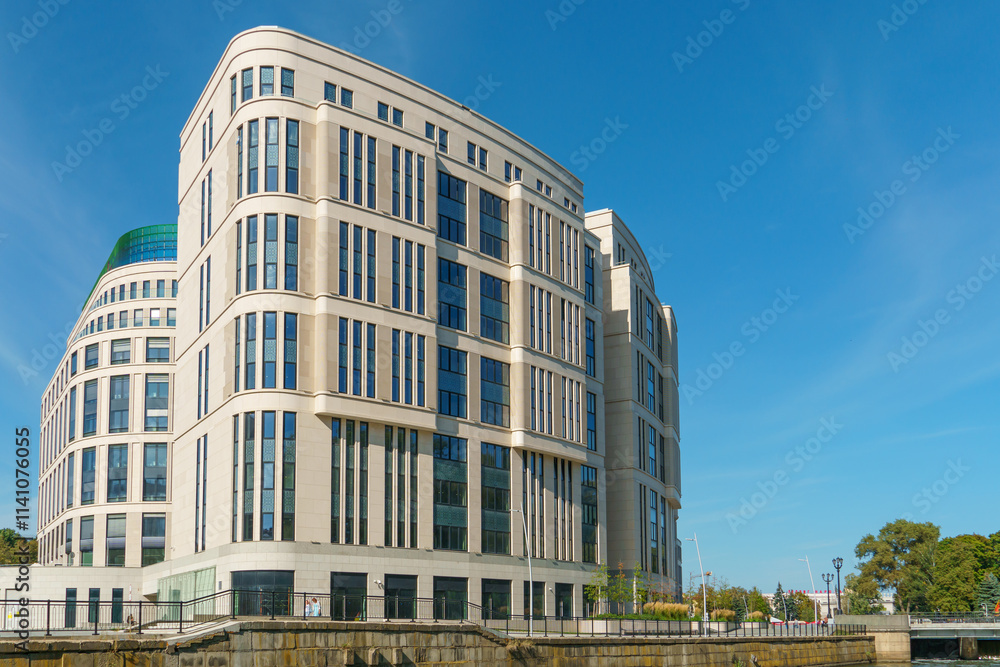 Modern skyscrapers in the new area. Tall buildings made of glass against the sky. Buying or renting luxury real estate. Modern skyscrapers in the new area. Tall buildings made of glass against the sky. Buying or renting luxury real estate.