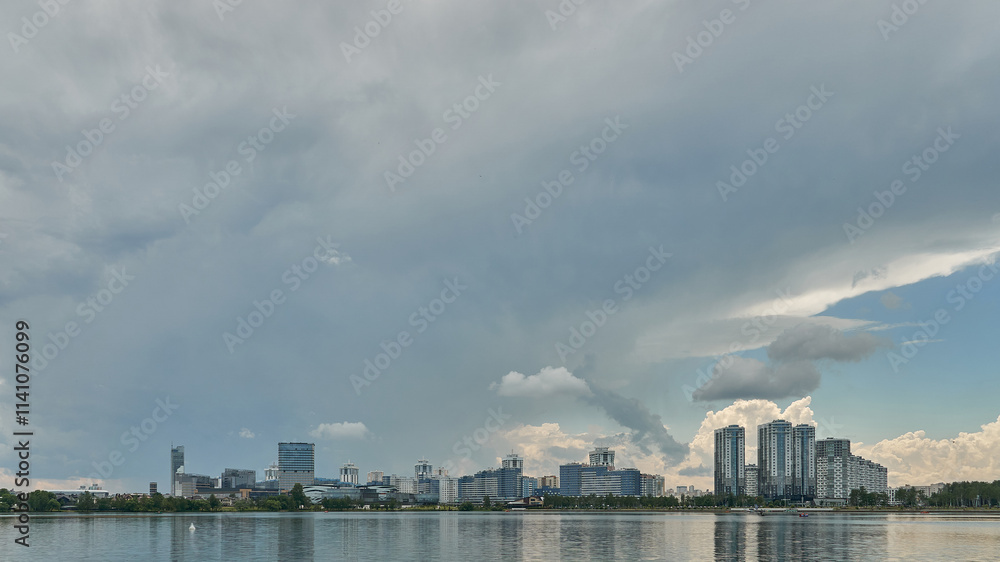 Modern skyscrapers in the new area. Tall buildings made of glass against the sky. Buying or renting luxury real estate. Modern skyscrapers in the new area. Tall buildings made of glass against the sky. Buying or renting luxury real estate.