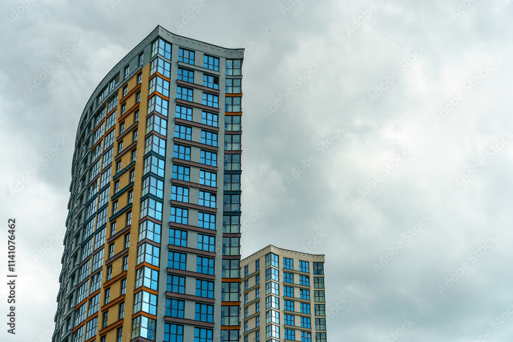 Modern skyscrapers in the new area. Tall buildings made of glass against the sky. Buying or renting luxury real estate. Modern skyscrapers in the new area. Tall buildings made of glass against the sky. Buying or renting luxury real estate.
