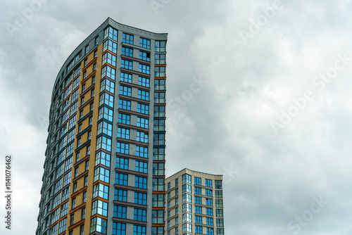 Modern skyscrapers in the new area. Tall buildings made of glass against the sky. Buying or renting luxury real estate.