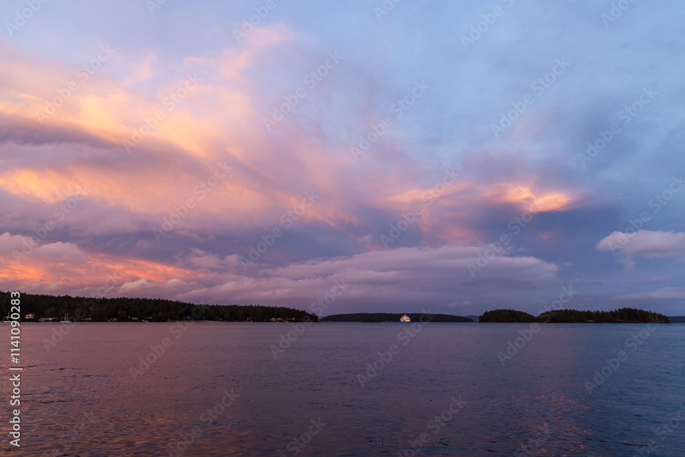 Serene Sunset Over Coastal Waters With Vibrant Orange and Purple Skies Serene Sunset Over Coastal Waters With Vibrant Orange and Purple Skies