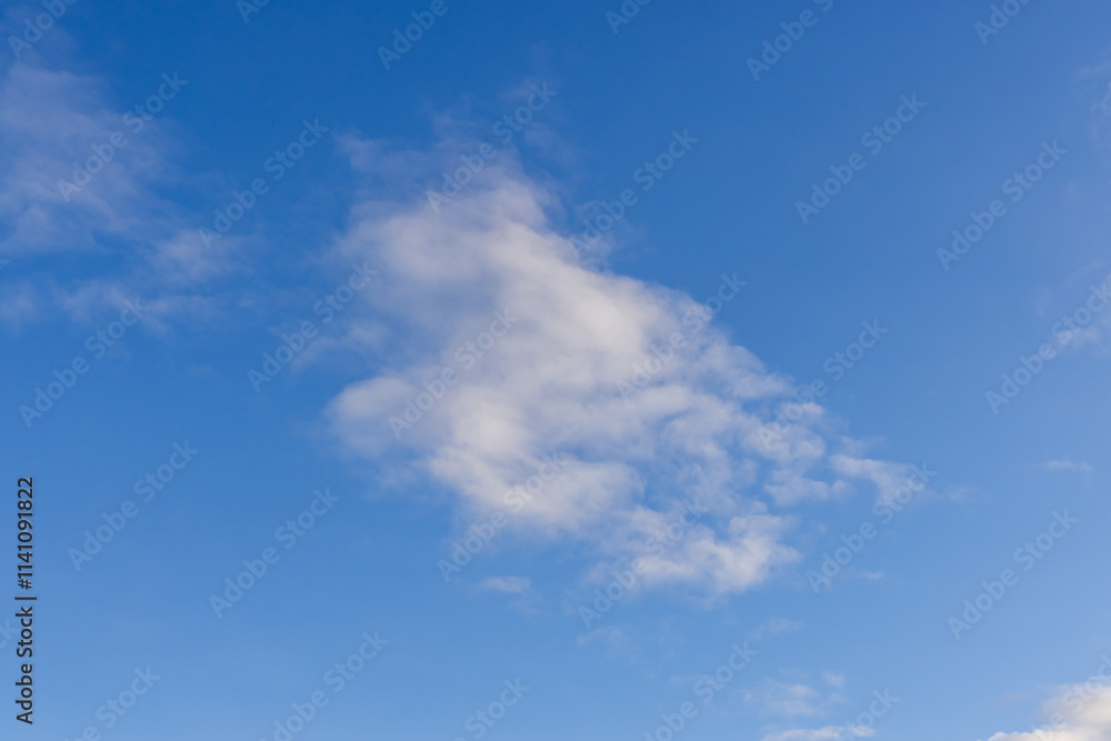 Bright Blue Sky with Wispy White Clouds on a Sunny Day Bright Blue Sky with Wispy White Clouds on a Sunny Day