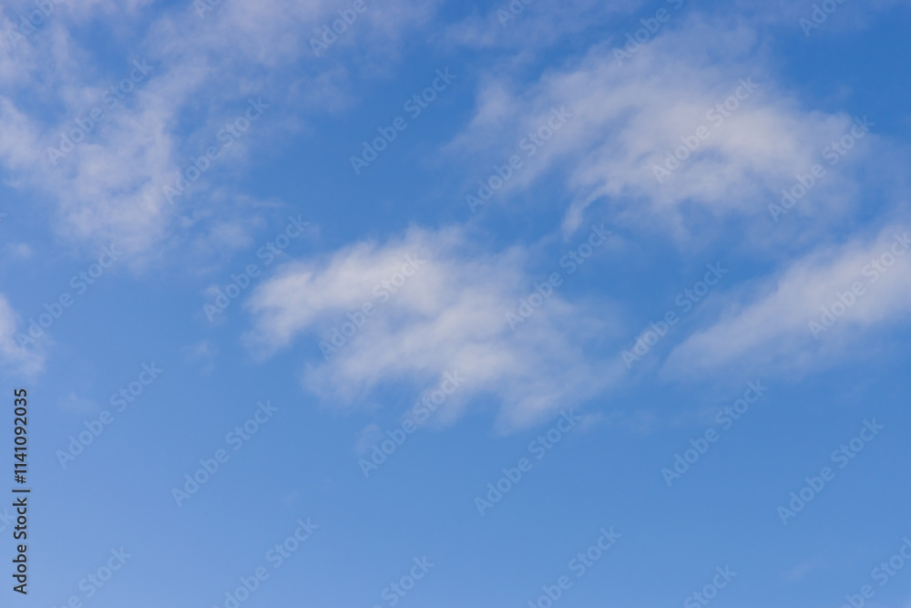 Clear Blue Sky with Wispy White Clouds on a Bright Day Clear Blue Sky with Wispy White Clouds on a Bright Day