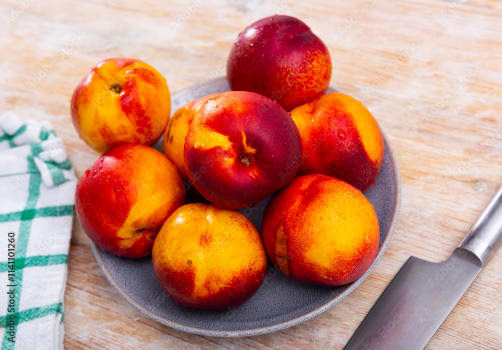 Fresh organic nectarine on wooden background, fruit vegan food Fresh organic nectarine on wooden background, fruit vegan food
