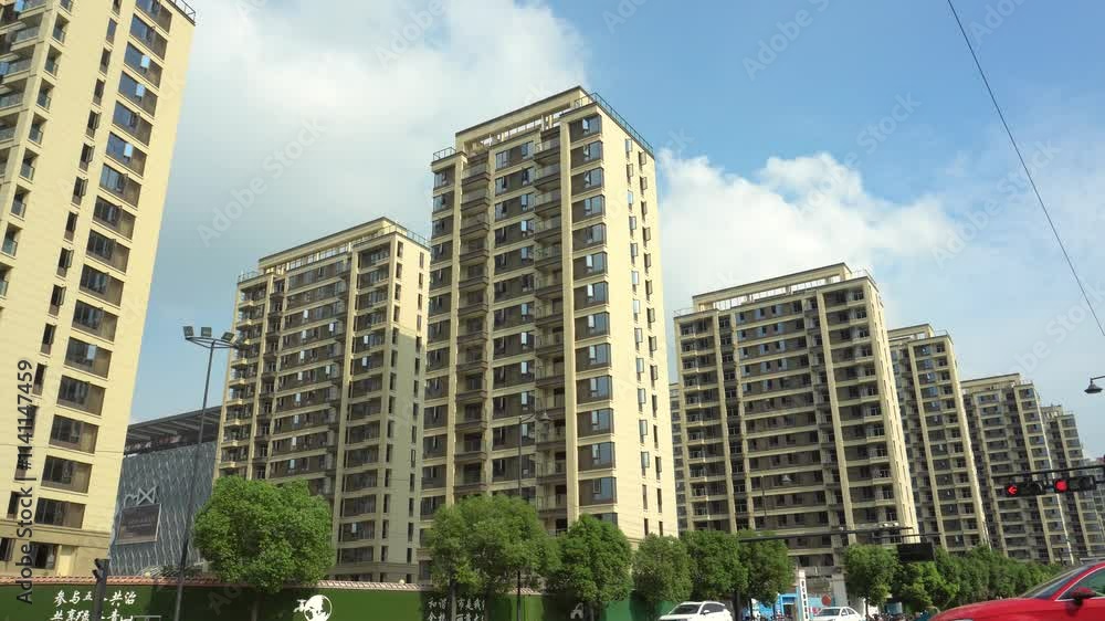 Urban residential area showcasing high-rise buildings and bustling street activity in clear daylight Urban residential area showcasing high-rise buildings and bustling street activity in clear daylight