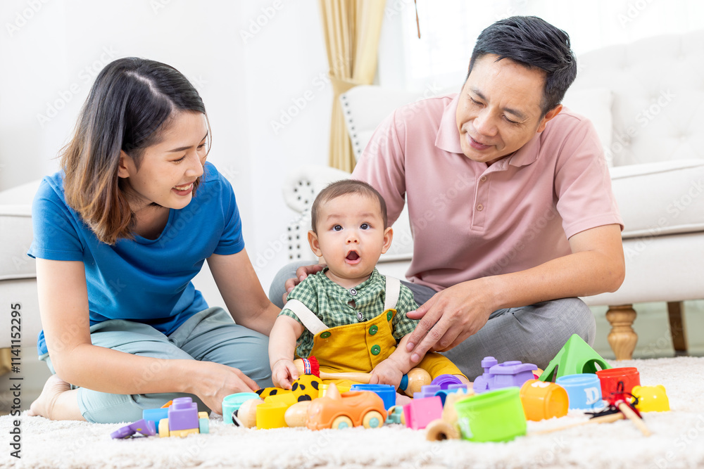 Asian family mother,father ,son playing with colorful kid toys. Happy baby boy in kindergarten or daycare. Child playing with colorful educational toys in preschool. Asian woman. Happy family. Asian family mother,father ,son playing with colorful kid toys. Happy baby boy in kindergarten or daycare. Child playing with colorful educational toys in preschool. Asian woman. Happy family.