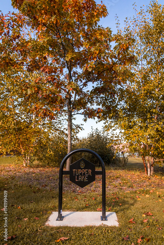 Tupper Lake NY logo sign at the waterfront park on a fall morning