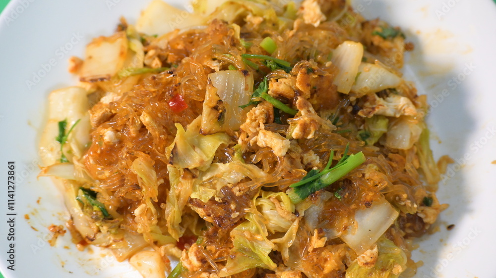 stir fried sukiyaki with egg and pork on white plate stir fried sukiyaki with egg and pork on white plate