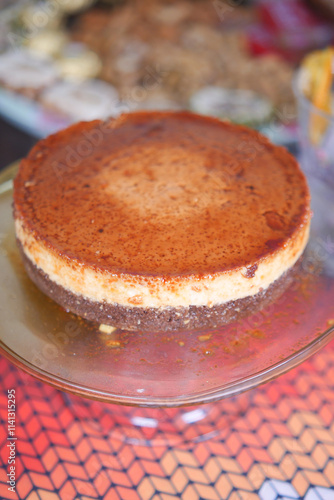  Caramel custard pudding on a plate on table  photo