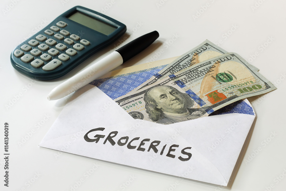 100 dollar bills in grocery envelope, budgeting concept 100 dollar bills in grocery envelope, budgeting concept