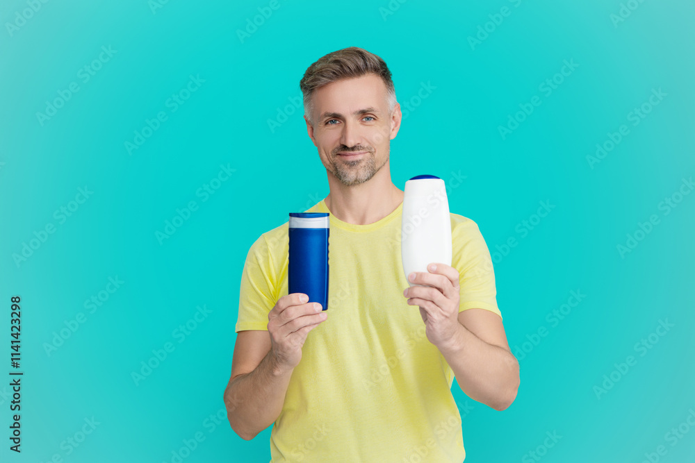 Presenting male cosmetics product. Man use shampoo. Mature man hold hair conditioner. Man with aftershave. Daily habit and personal care. Skincare cosmetic. Shower aftershave. Choose right products Presenting male cosmetics product. Man use shampoo. Mature man hold hair conditioner. Man with aftershave. Daily habit and personal care. Skincare cosmetic. Shower aftershave. Choose right products