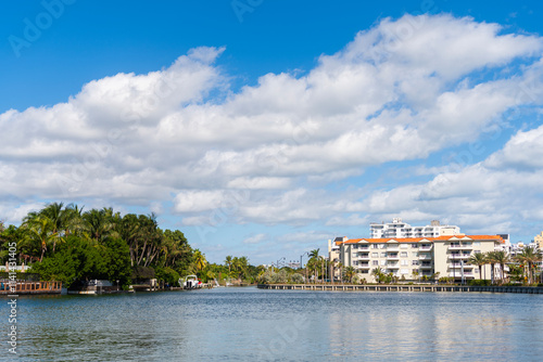 Vacation building in summer. Luxury waterfront house. Hotel building view. Residential architecture. Modern building. Residential apartment in waterfront city. Waterfront landscape with house