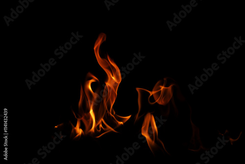 Fire flames on black background. Fire flame texture. Fire flame with copy space. Flames textured background. Flames on black background.