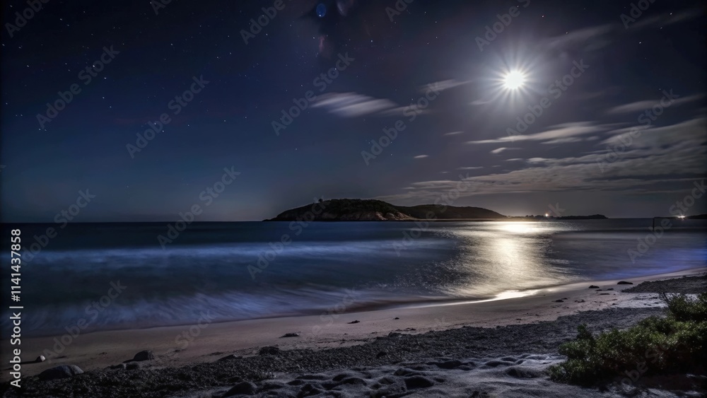 Fototapeta premium Moonlit Beach with Silky Waves and a Distant Island