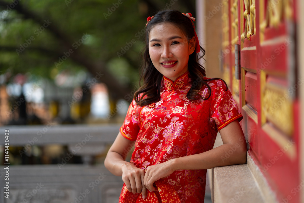 Young beautiful Woman in Red Qipao at Traditional Chinese Temple Young beautiful Woman in Red Qipao at Traditional Chinese Temple