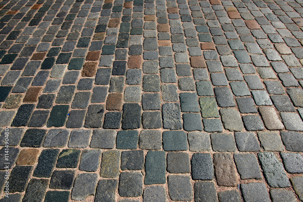 Fototapeta premium Stone pavement texture. Granite cobblestoned pavement background. Pavement texture.