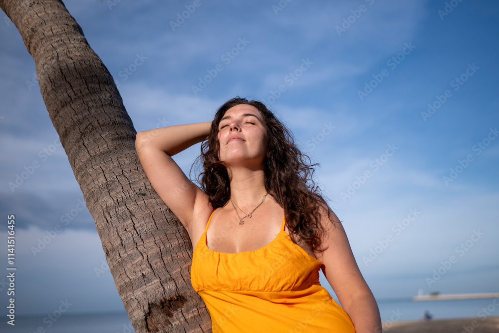 Portrait beautiful woman against a palm tree on a serene beach relaxed and confident, enjoying the peacefulness of the environment leisure and the beauty of nature concept. Portrait beautiful woman against a palm tree on a serene beach relaxed and confident, enjoying the peacefulness of the environment leisure and the beauty of nature concept.