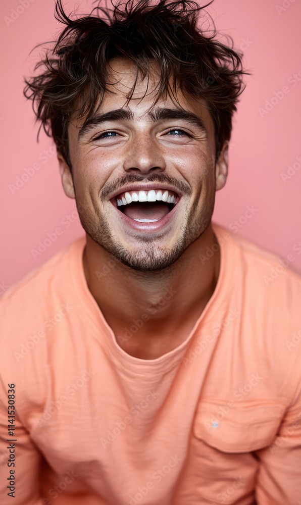 man with casual t-shirt is smiling at the camera, solid color background man with casual t-shirt is smiling at the camera, solid color background