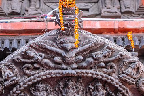 Wooden art carving, Handmade carving of hindu god on wood at temple. photo