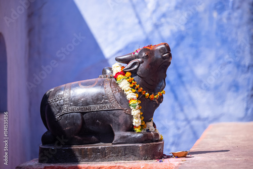 Idol of nandi bull made with marble at lord shiv temple in varanasi.
