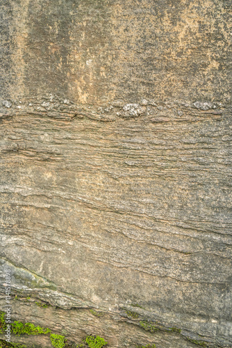 Natural Rock Wall With Layered Textures And Moss