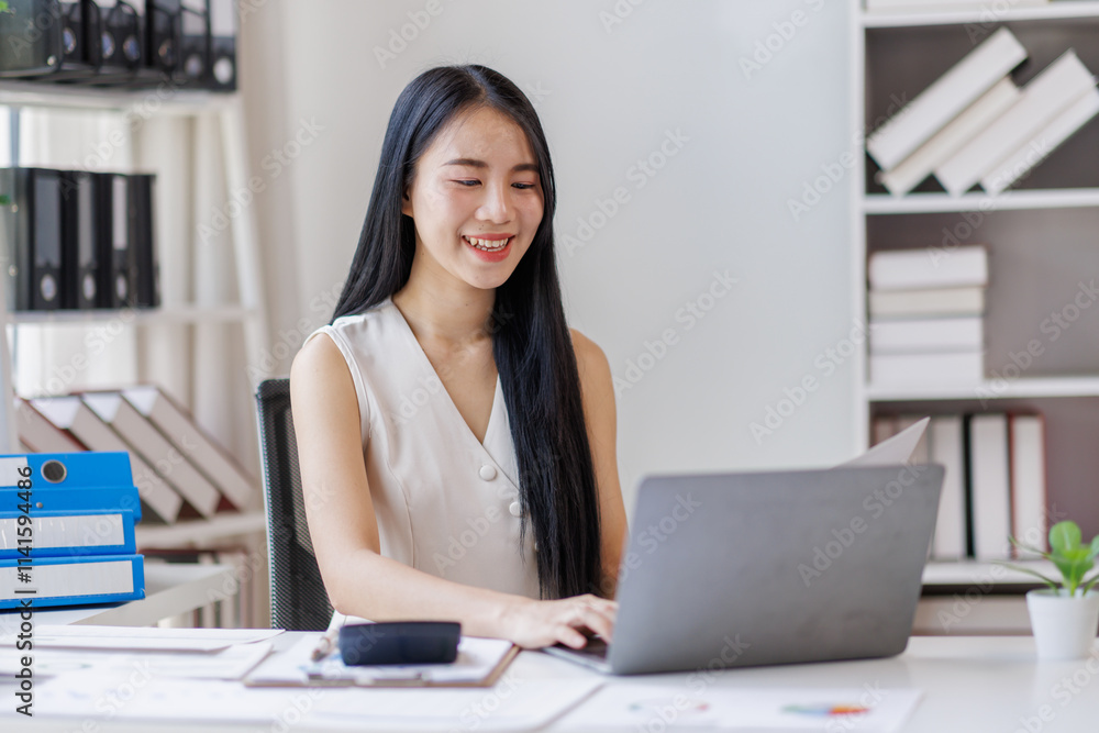 Young business asian woman working at office with documents on desk, doing planning analyzing the financial report, business plan investment, finance analysis concept Young business asian woman working at office with documents on desk, doing planning analyzing the financial report, business plan investment, finance analysis concept