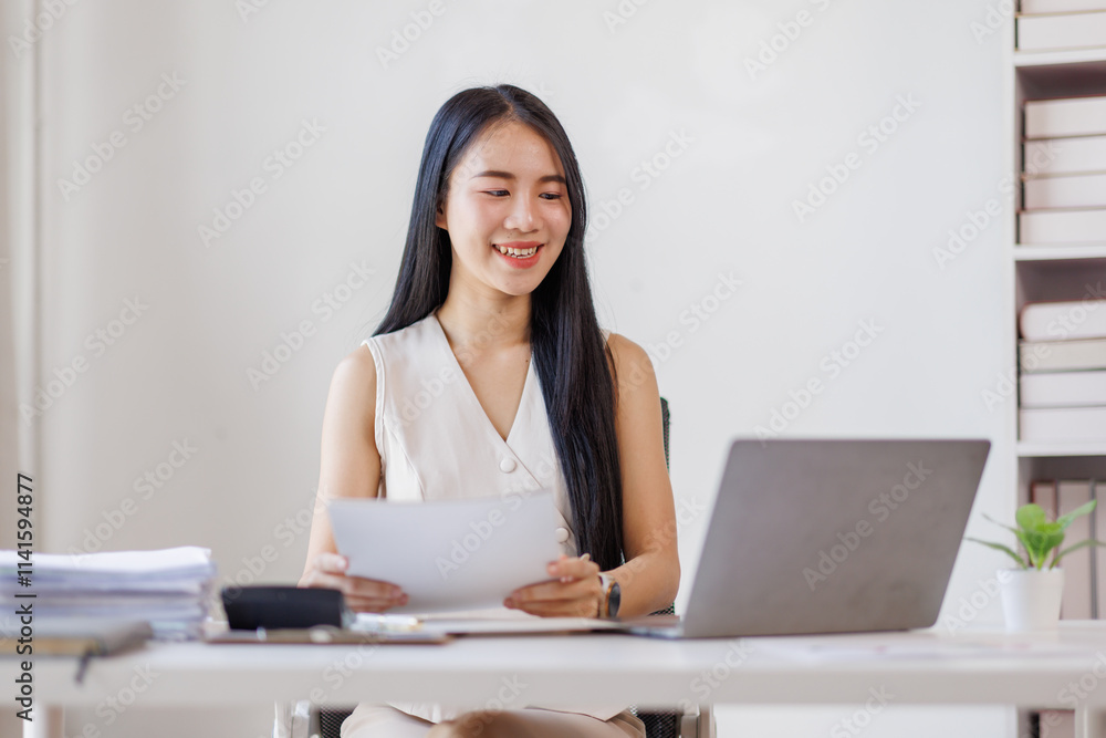 Young business asian woman working at office with documents on desk, doing planning analyzing the financial report, business plan investment, finance analysis concept Young business asian woman working at office with documents on desk, doing planning analyzing the financial report, business plan investment, finance analysis concept