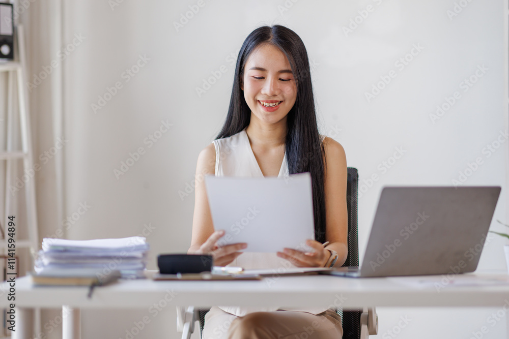Young business asian woman working at office with documents on desk, doing planning analyzing the financial report, business plan investment, finance analysis concept Young business asian woman working at office with documents on desk, doing planning analyzing the financial report, business plan investment, finance analysis concept