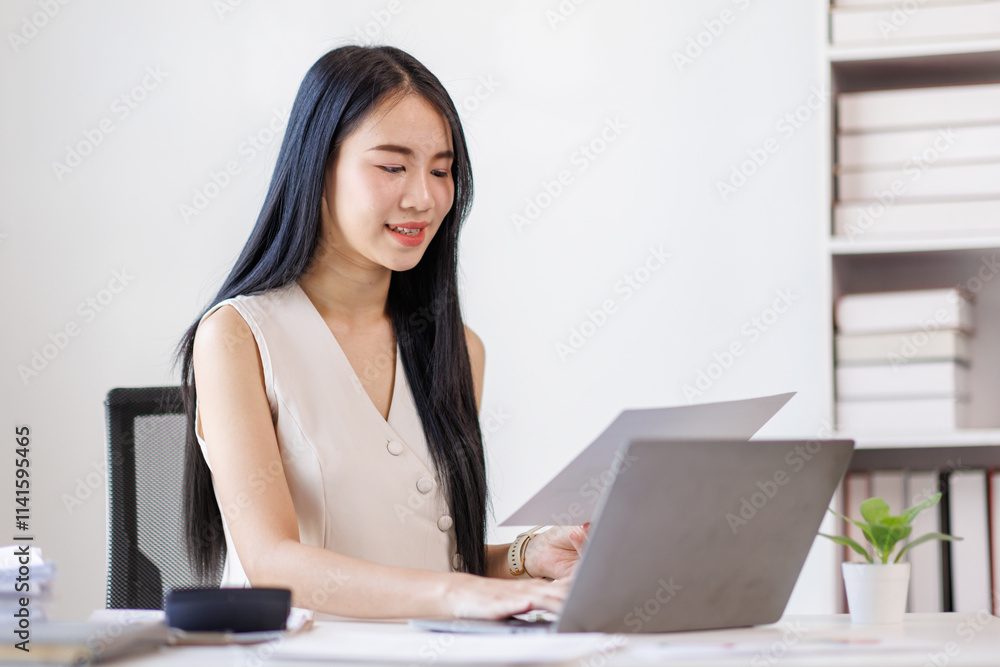 Young business asian woman working at office with documents on desk, doing planning analyzing the financial report, business plan investment, finance analysis concept Young business asian woman working at office with documents on desk, doing planning analyzing the financial report, business plan investment, finance analysis concept