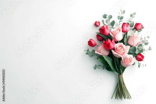 A beautiful bouquet of pink and red roses, accented with greenery, arranged elegantly against a light background.