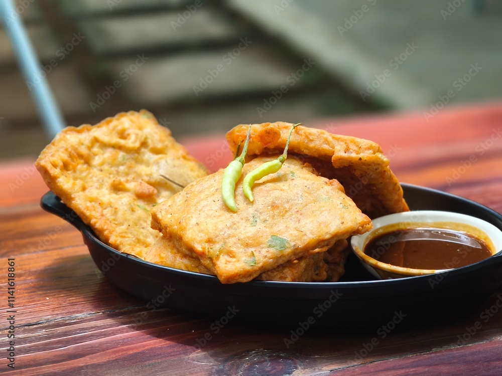 Golden brown Tempe Mendoan, a crispy Indonesian snack Golden brown Tempe Mendoan, a crispy Indonesian snack