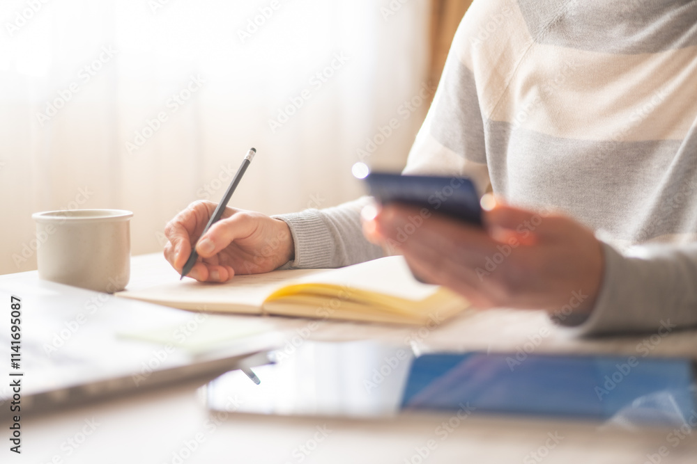Busy Professional Woman Organizing Work From Home Or Office, Writing Notes, Managing Client Meetings, Reviewing Emails, Monitoring Calendar, Using Smartphone, And Observing Business Data Busy Professional Woman Organizing Work From Home Or Office, Writing Notes, Managing Client Meetings, Reviewing Emails, Monitoring Calendar, Using Smartphone, And Observing Business Data