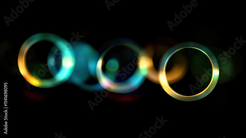 Dreamy bokeh light effect vibrant colorful abstract circles glowing dark background defocused highlights circular light rings teal gold blue green yellow orange iridescent magical fantasy ethereal photo