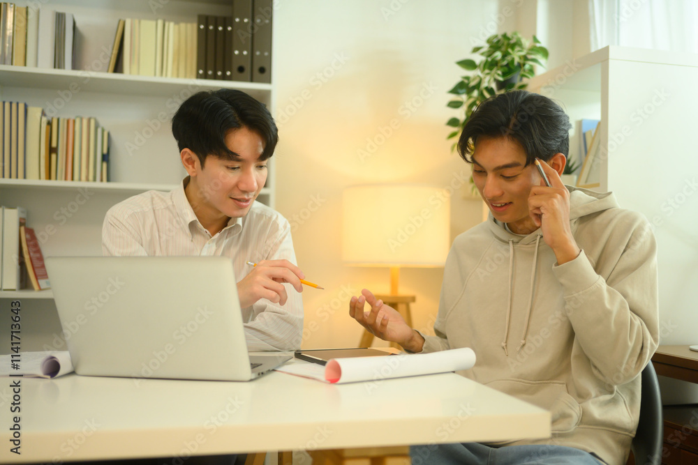 Tutor and student sharing ideas and discussing study materials during a home tutoring session