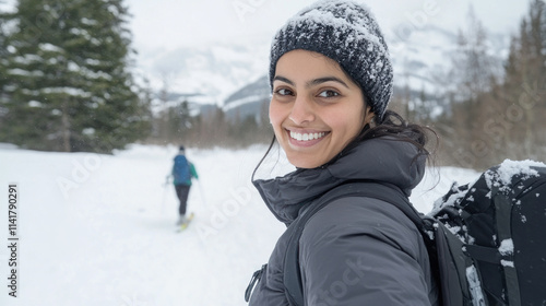 Indian woman snowshoeing together in winter at Banff National Park Canada